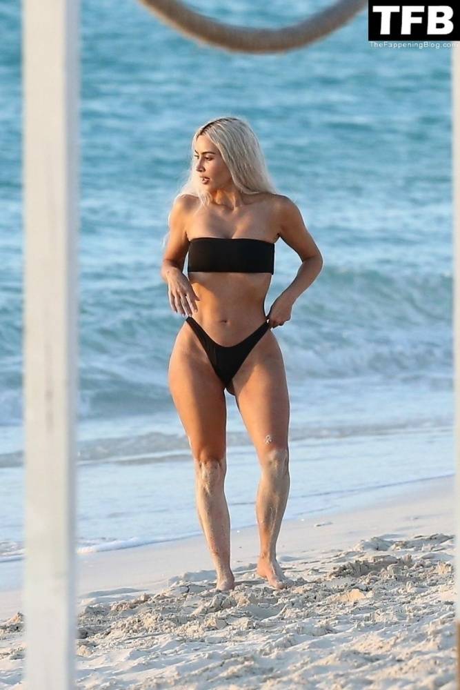 Kim Kardashian Enjoys a Sweet Moment on the Beach During a Family Vacation to Turks and Caicos - #4