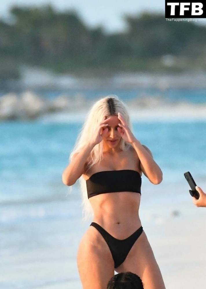 Kim Kardashian Enjoys a Sweet Moment on the Beach During a Family Vacation to Turks and Caicos - #6