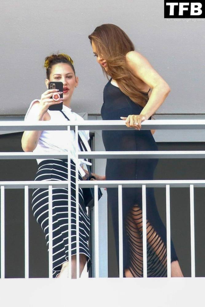 Chrissy Teigen & John Legend Kiss and Pose During an Impromptu Balcony Shoot - #7