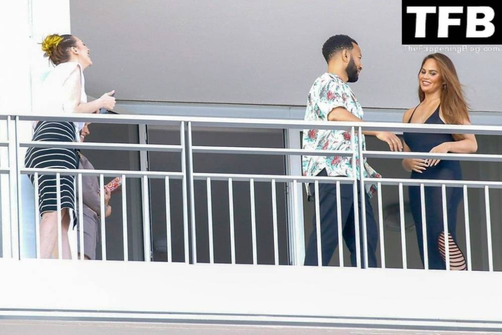 Chrissy Teigen & John Legend Kiss and Pose During an Impromptu Balcony Shoot - #4