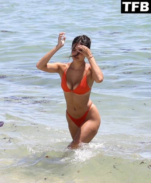 Tao Wickrath Stuns in Small Orange Bikini on the Beach in Miami - county Miami on modelclub.info