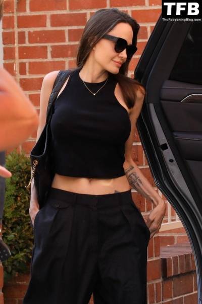 Angelina Jolie Shows Off Her Tight Tummy Leaving an Office Building on modelclub.info